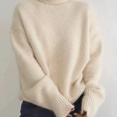 Christine Brewer Kennedy high neck women's sweater in cozy cream knit, perfect for fall and winter, with a relaxed fit.