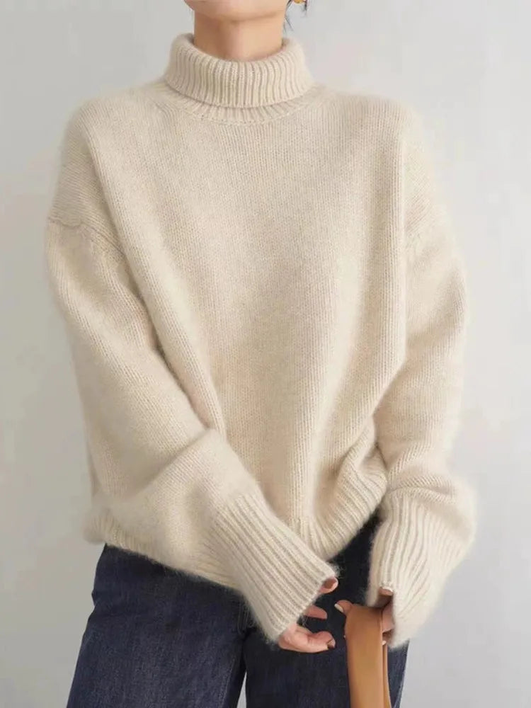 Christine Brewer Kennedy high neck women's sweater in cozy cream knit, perfect for fall and winter, with a relaxed fit.