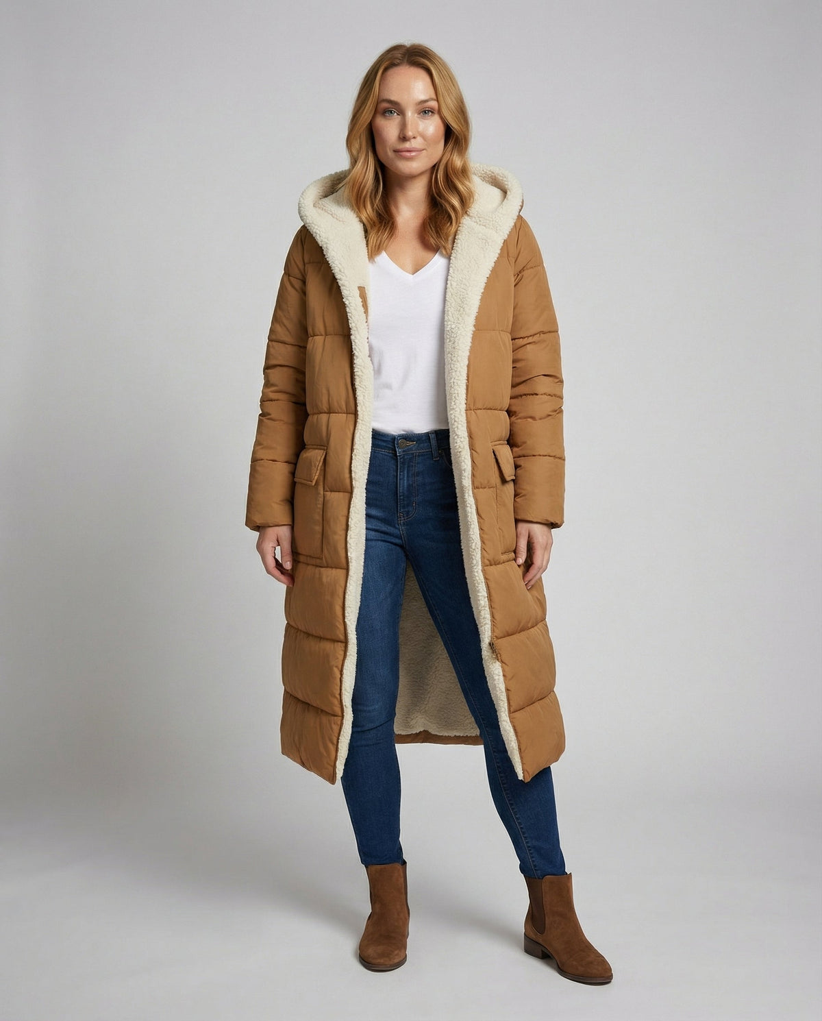 Christine Brewer Iris long puffer jacket for women, reversible sherpa fleece winter coat, full-body front view.