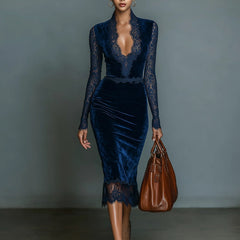 Dark blue velvet V-neck midi dress by Christine Brewer, featuring a fitted waist and flowing skirt, ideal for evening occasions.