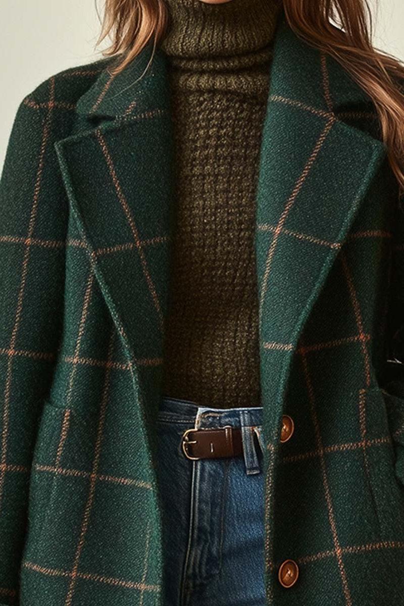 Elegant checkered green long coat for women by Christine Brewer featuring a two-button closure, ideal for timeless winter style.
