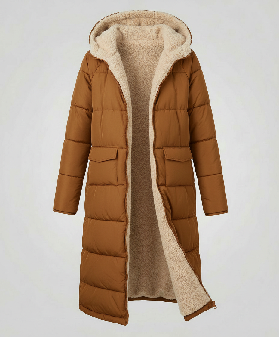 Brown Iris long puffer jacket for women by Christine Brewer, shown on a model with a winter outdoor setting.