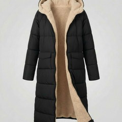 Long puffer jacket for women by Christine Brewer, featuring a floral button design and a stylish, insulated outerwear look.