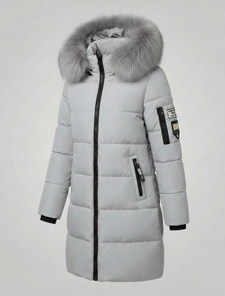 Christina Brewer Sadie women's cosy puffer jacket with front pockets, shown with zipper detail on a neutral background.