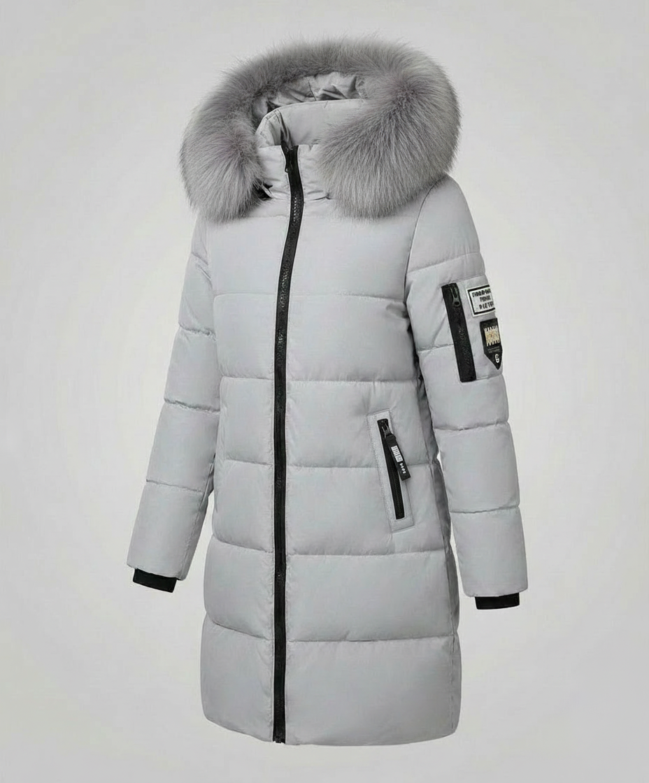 Christina Brewer Sadie women's cosy puffer jacket with front pockets, shown with zipper detail on a neutral background.