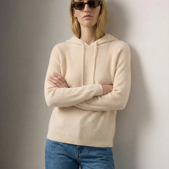 Cream-colored Claudia cashmere hoodie for women by Christine Brewer, showing a cozy, soft fabric with a relaxed fit.