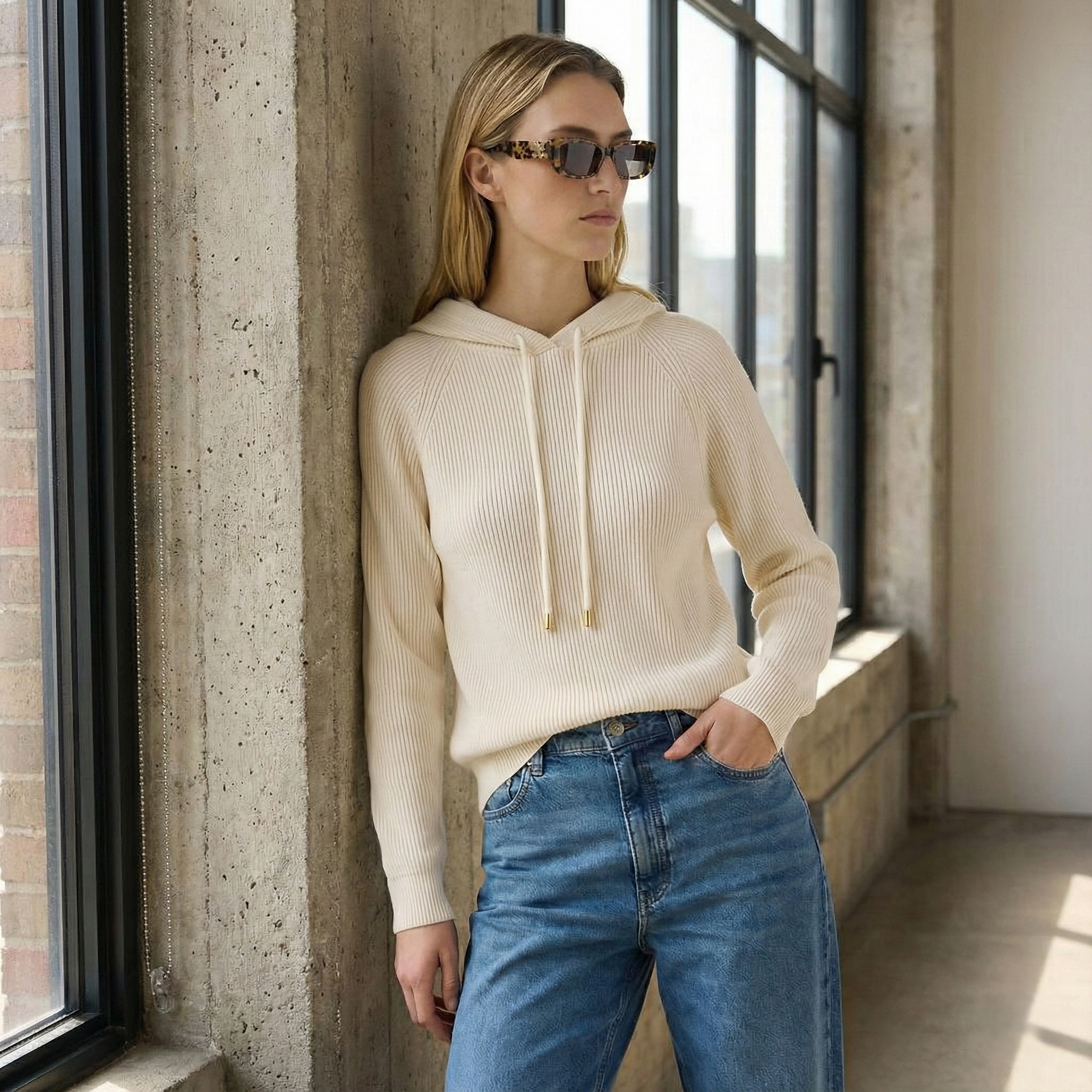 Cream-colored Claudia cashmere hoodie for women by Christine Brewer, featuring a cozy, soft knit fabric and relaxed fit.