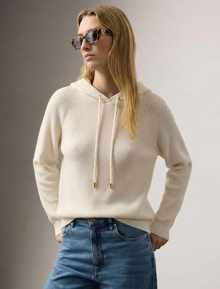 Cream-colored Claudia cashmere hoodie for women by Christine Brewer, featuring a cozy, relaxed fit and soft knit texture.