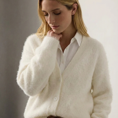 Oversized cashmere cardigan for women by Christine Brewer, featuring a soft, cozy fit in a light, neutral color.