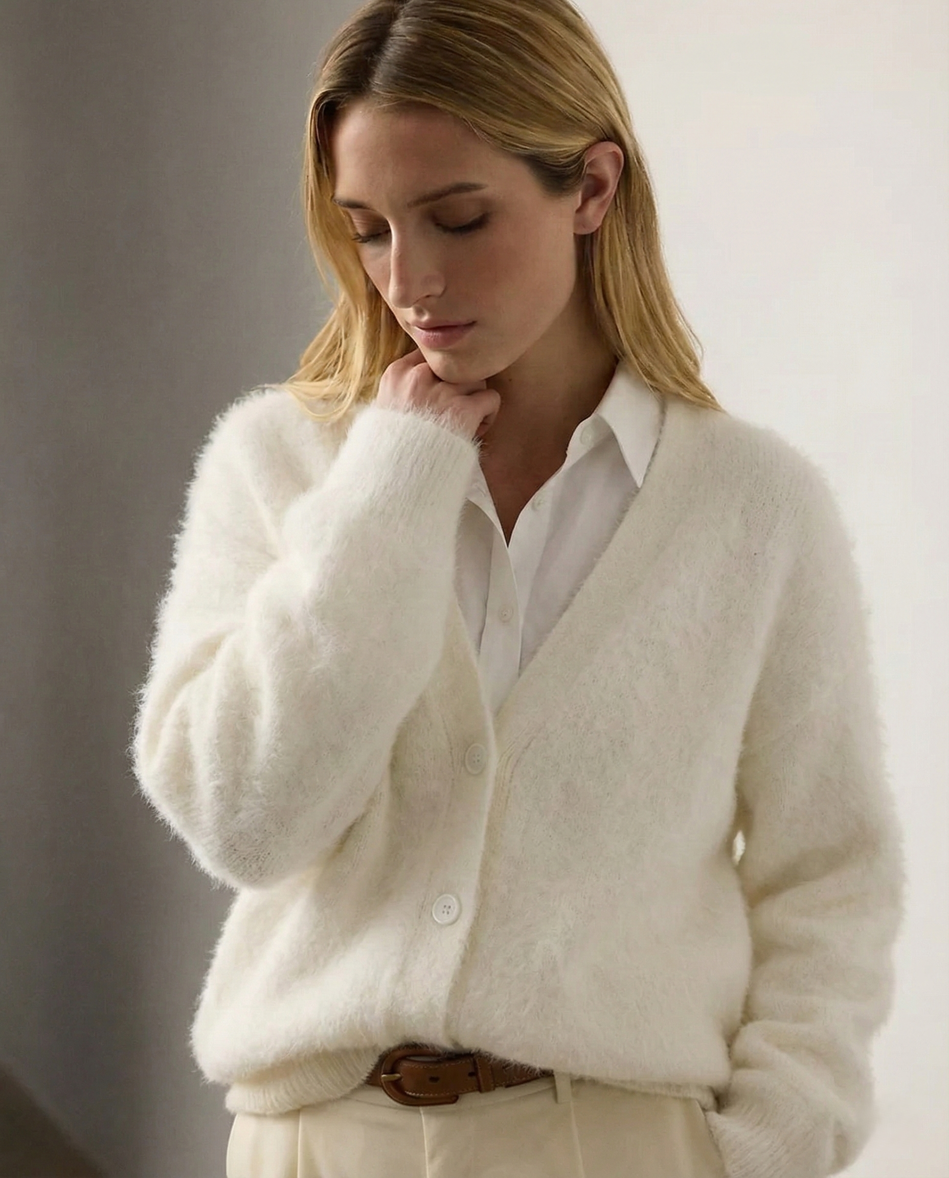Oversized cashmere cardigan for women by Christine Brewer, featuring a soft, cozy fit in a light, neutral color.