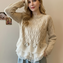 Cream-colored Zoe cable knit sweater by Christine Brewer with a relaxed fit, chunky knit texture, and cozy style.