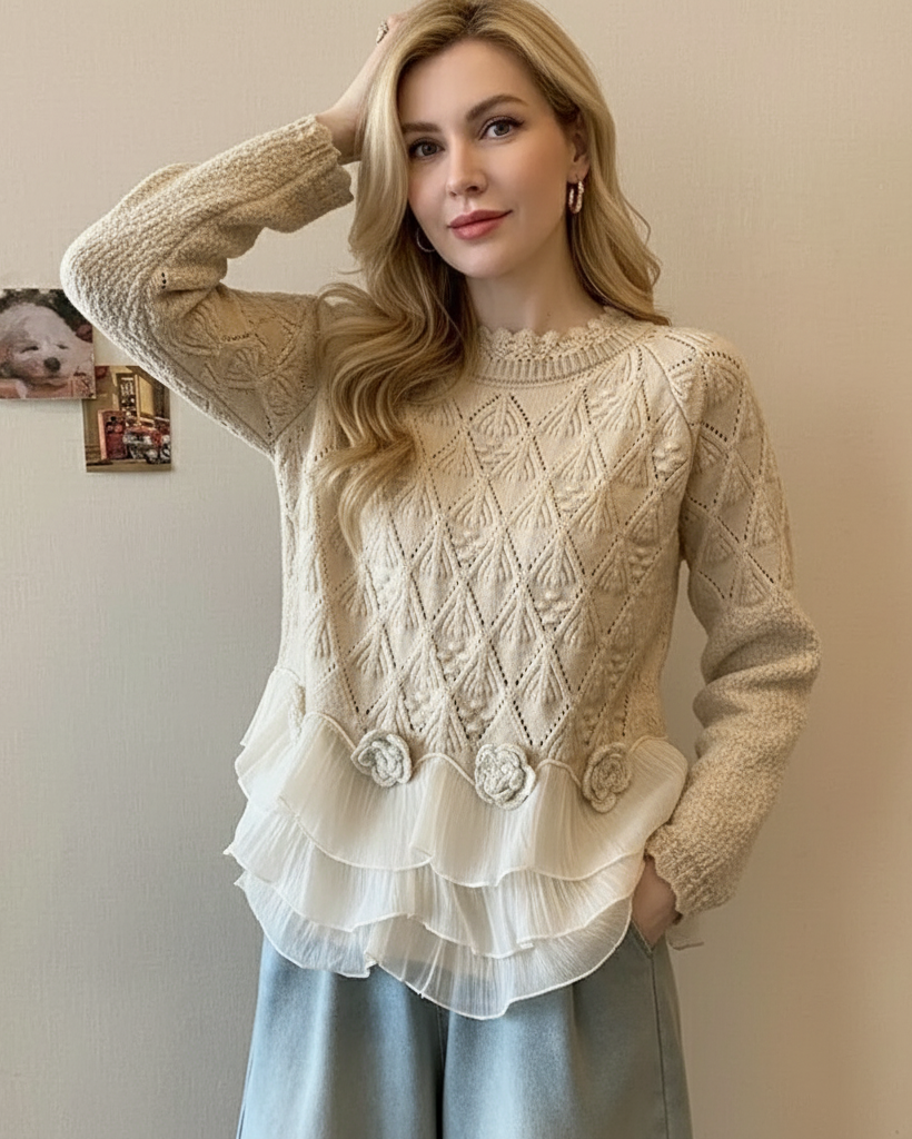 Cream-colored Zoe cable knit sweater by Christine Brewer with a relaxed fit, chunky knit texture, and cozy style.
