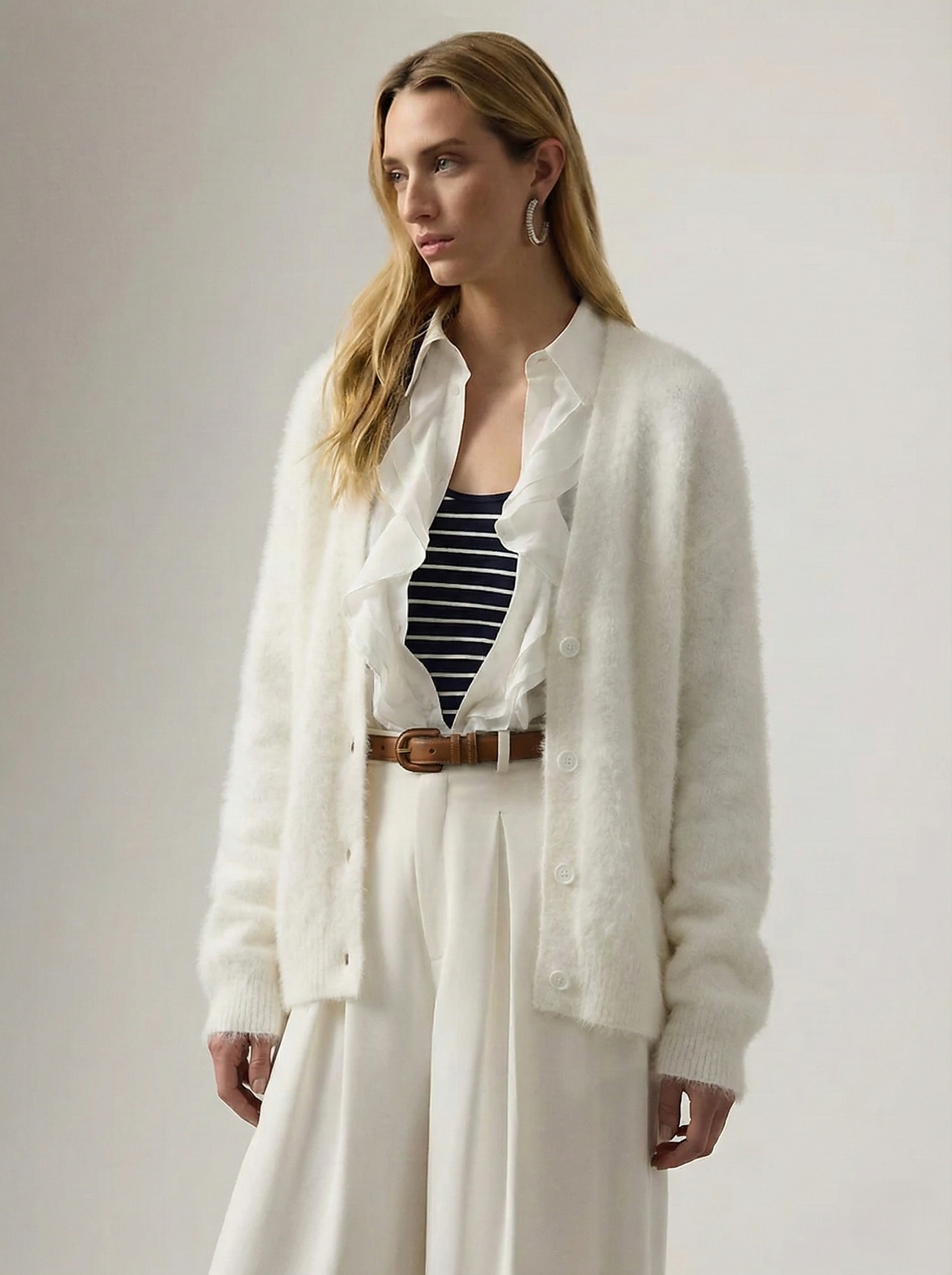 Cream oversized cashmere cardigan for women from Christine Brewer, featuring a relaxed fit and cozy knit texture.