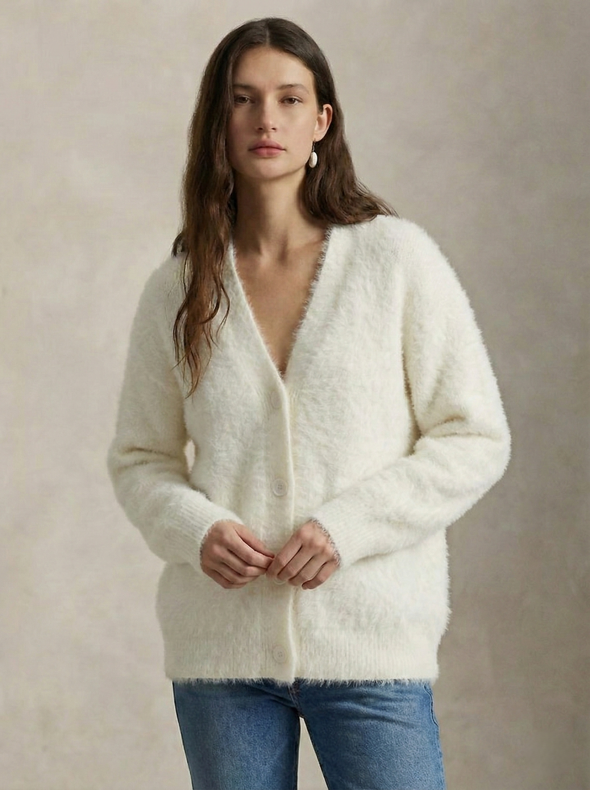 Oversized cashmere cardigan for women in soft cream from Christine Brewer, featuring a cozy, relaxed fit and knit texture.