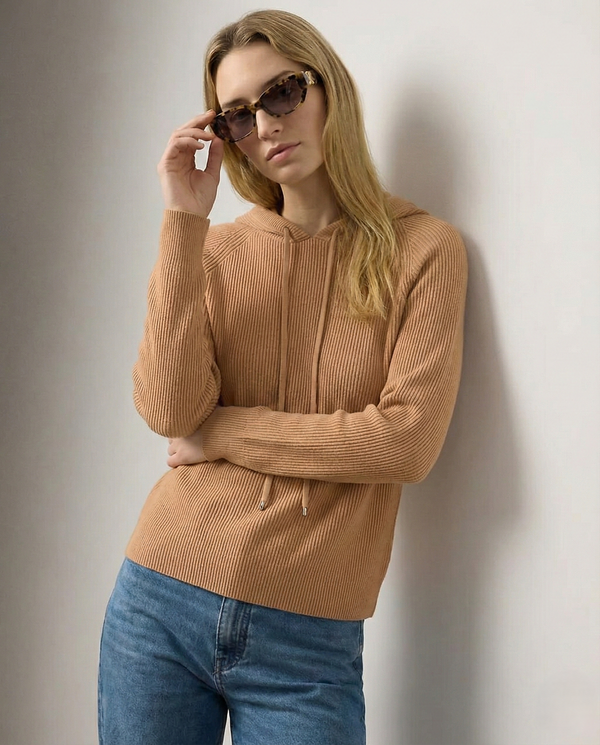 Christine Brewer Claudia women's cashmere hoodie in soft grey, showcasing a cozy, relaxed fit with a hood and front pocket.