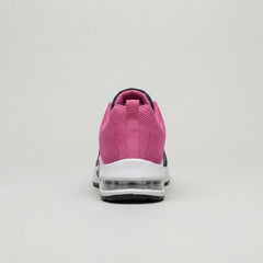 Close-up of women's knit sneakers by Christine Brewer showing their textured fabric and casual, comfortable style.