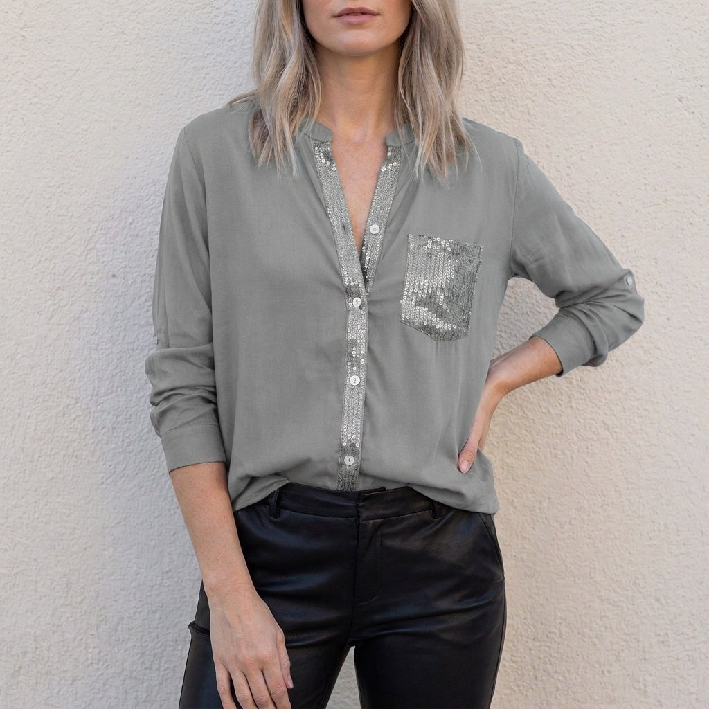 Gray women's denim summer blouse with V-neck and button front, featuring a relaxed fit and casual style by Christine Brewer.
