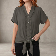 Gray women's summer blouse with V-neck and ruffle details, casual denim style by Christine Brewer.