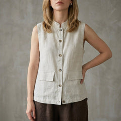 Gray sleeveless denim summer blouse for women with button front, from Christine Brewer, shown on a model.