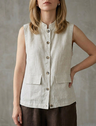 Gray sleeveless denim summer blouse for women with button front, from Christine Brewer, shown on a model.