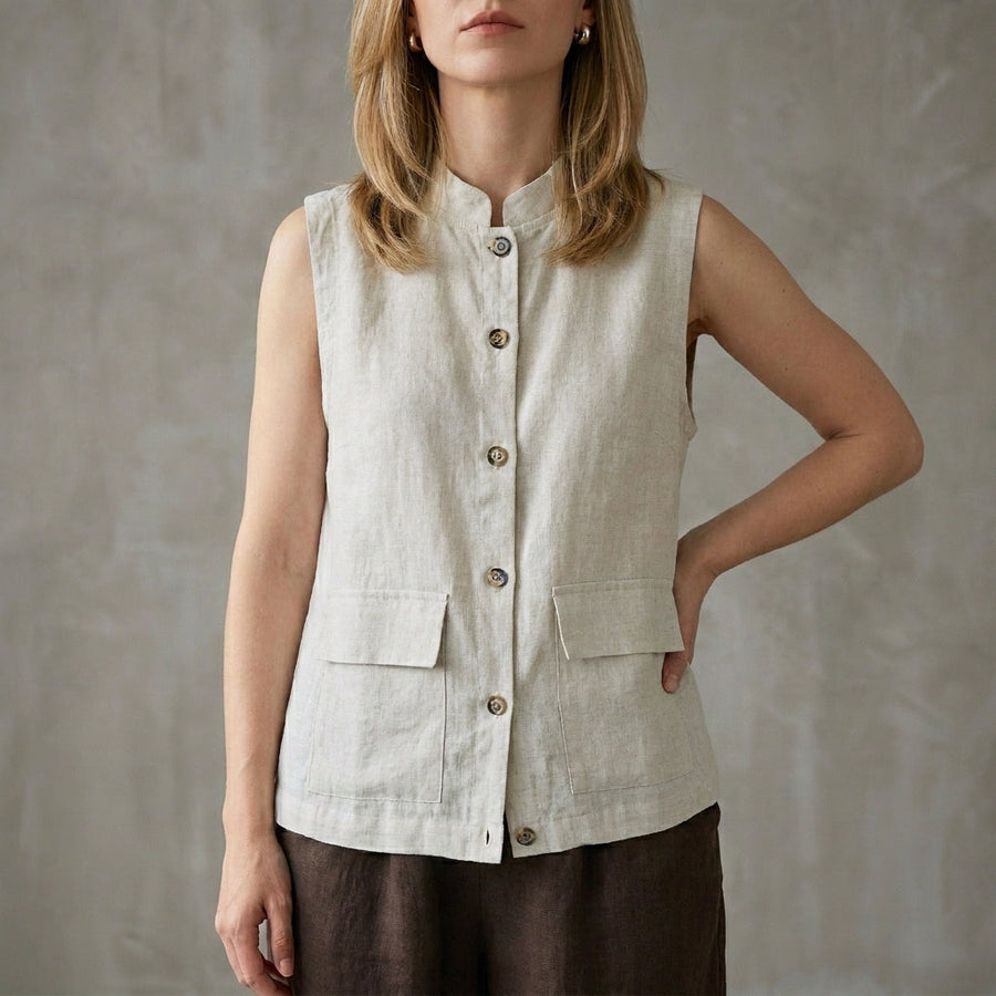 Gray sleeveless denim summer blouse for women with button front, from Christine Brewer, shown on a model.