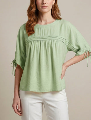 Green linen summer blouse for women by Christine Brewer, flowy top with a relaxed fit and lightweight fabric.