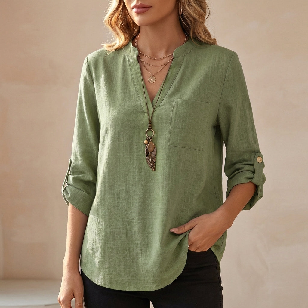 Green V-neck linen summer blouse for women by Christine Brewer, flowy and lightweight top perfect for warm weather.