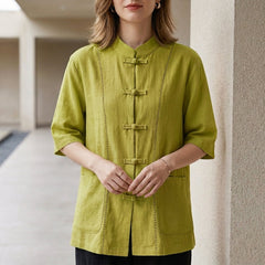 Green summer blouse for women with denim pockets by Christine Brewer, styled with a relaxed fit and lightweight fabric.