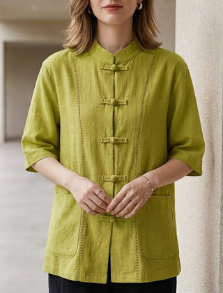 Green summer blouse for women with denim pockets by Christine Brewer, styled with a relaxed fit and lightweight fabric.