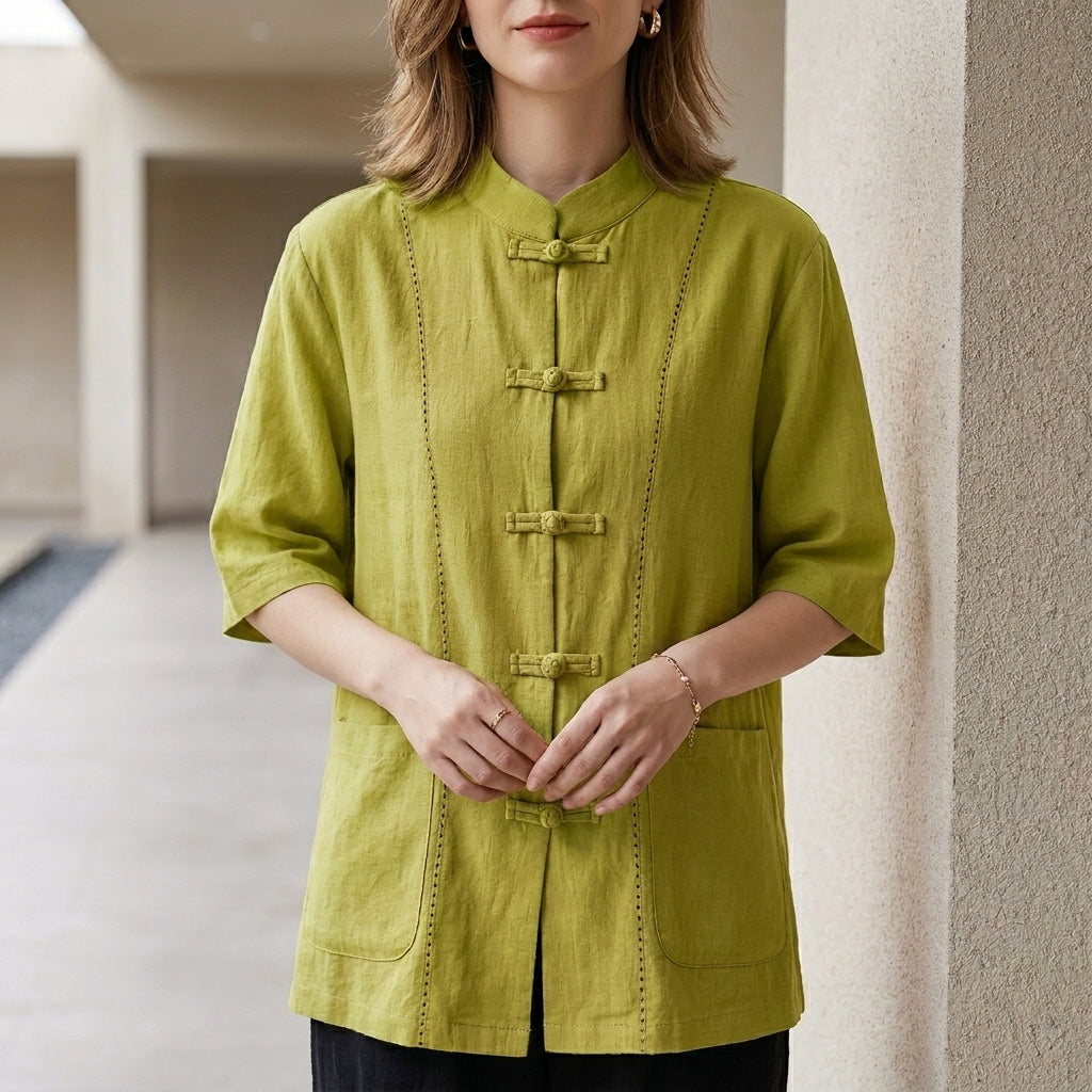 Green summer blouse for women with denim pockets by Christine Brewer, styled with a relaxed fit and lightweight fabric.