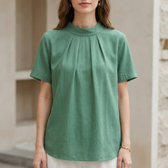 Green high-neck short sleeve summer blouse for women by Christine Brewer, featuring a stylish and comfortable top.