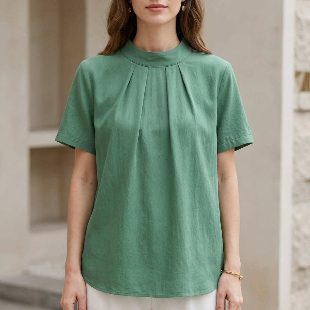 Green high-neck short sleeve summer blouse for women by Christine Brewer, featuring a stylish and comfortable top.