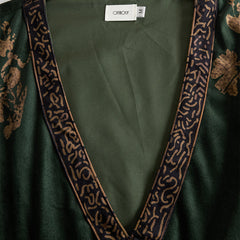 Green faux suede tassel maxi dress for women by Christine Brewer, featuring a flowing silhouette with tassel details.