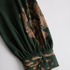 Green faux suede tassel maxi dress for women by Christine Brewer, featuring a flowing silhouette and stylish tassel details.