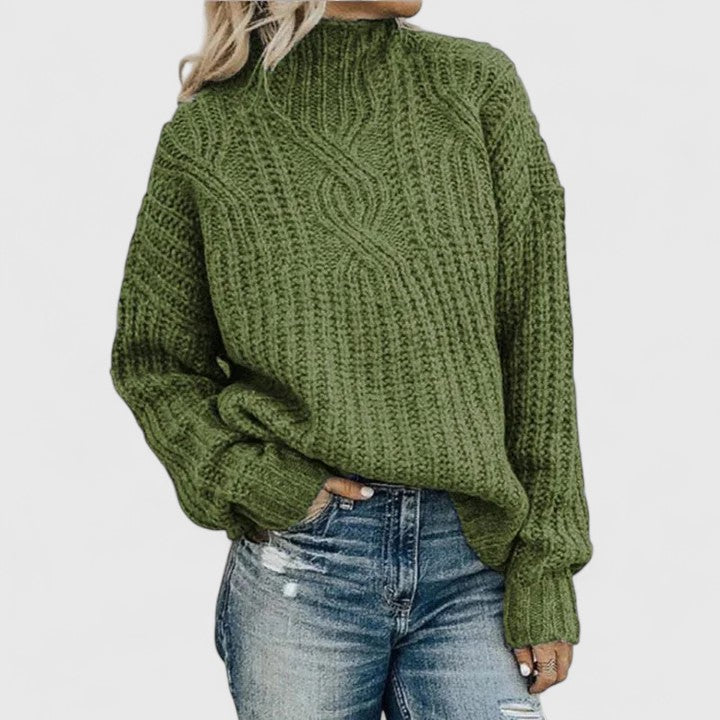 Cable knit sweater for women, Tabitha by Christine Brewer, featuring a cozy textured design and ribbed cuffs.