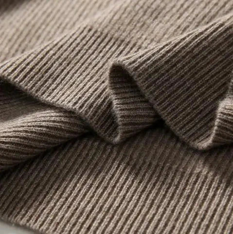 Women's Claudia cashmere hoodie by Christine Brewer, soft beige fabric with a relaxed fit and hood, ideal for cozy casual wear.
