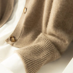 Christina Christine Brewer women's cashmere high neck cardigan in a cozy, soft knit, featuring a stylish high neckline and button details.