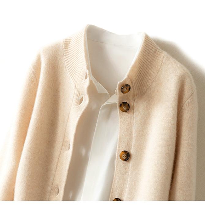 Christina cashmere high neck cardigan for women, soft beige color, featuring a cozy high neckline and button-front design.