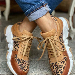Comfortable leopard print sneakers for women by Christine Brewer, featuring orthopedic support and ideal for walking.