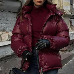 Black Christine Brewer Delilah hooded quilted puffer jacket for women with insulated warmth and stylish design.