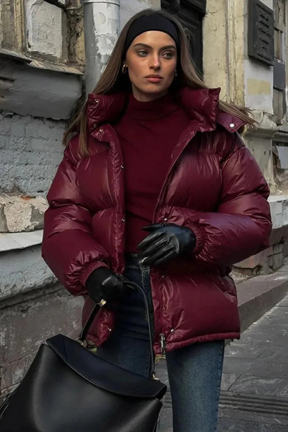 Black Christine Brewer Delilah hooded quilted puffer jacket for women with insulated warmth and stylish design.