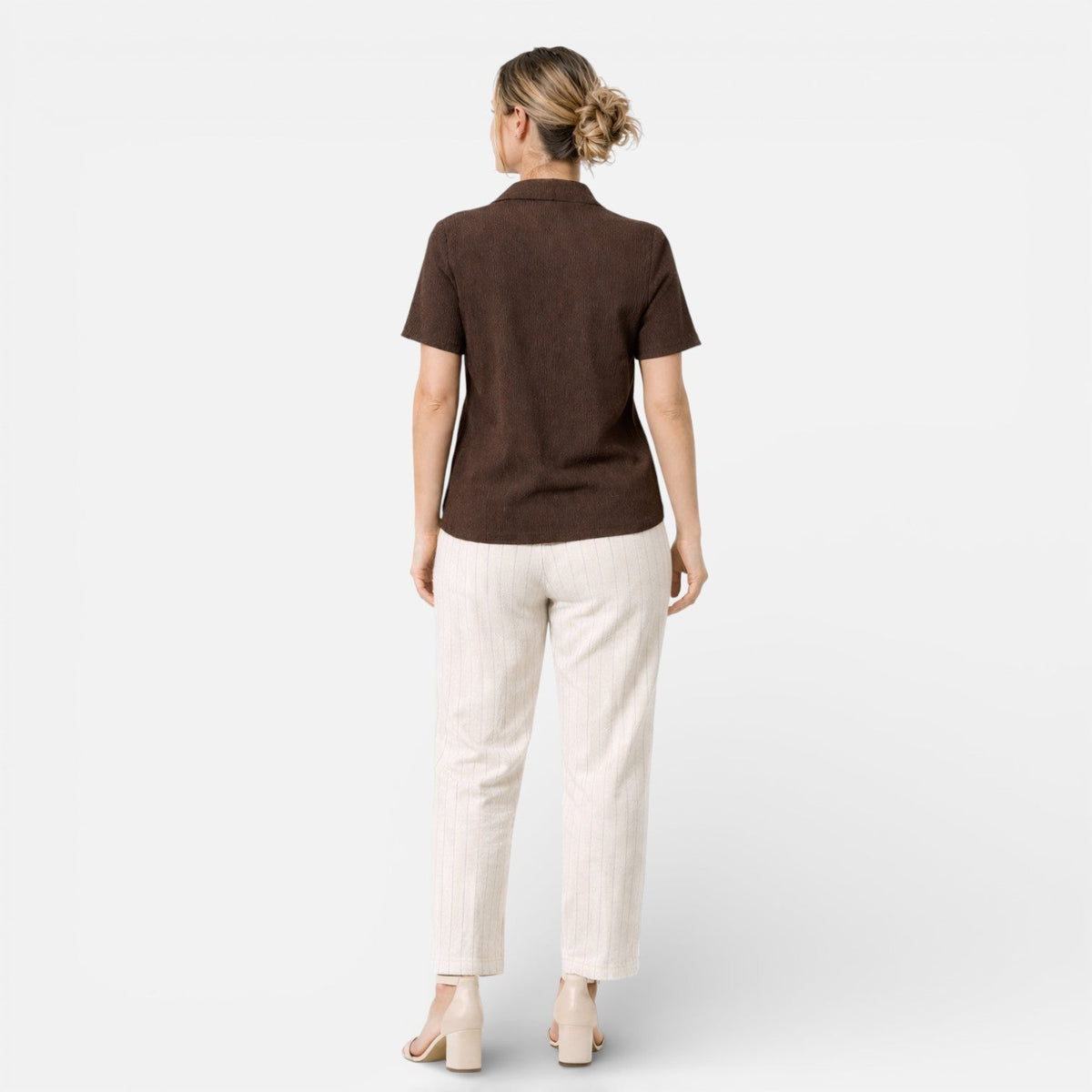 Women's short sleeve button-up shirt by Christine Brewer, classic style with a tailored fit, shown in a light fabric.