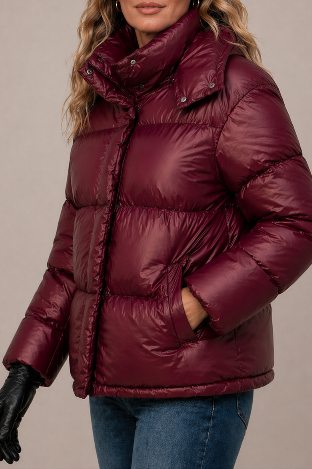 Insulated hooded quilted puffer jacket for women by Christine Brewer, featuring a stylish design and warm, padded exterior.