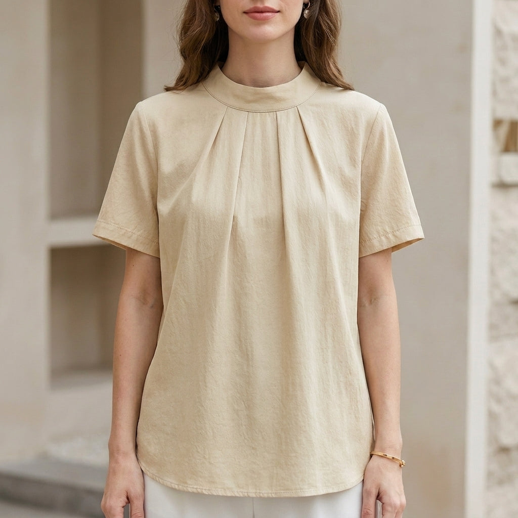 Ivory yellow summer blouse for women by Christine Brewer, high neck short sleeve top with a lightweight, stylish design.