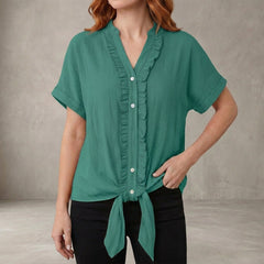 Lake green summer blouse for women by Christine Brewer featuring a V-neck, denim fabric, and ruffle details, casual style top.