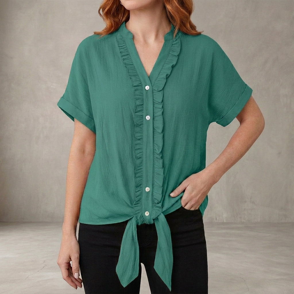 Lake green summer blouse for women by Christine Brewer featuring a V-neck, denim fabric, and ruffle details, casual style top.