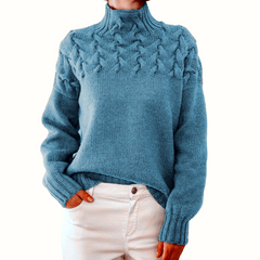 Light blue women's turtleneck sweater from Christine Brewer's Tessa knitwear collection, featuring a cozy, fitted design.