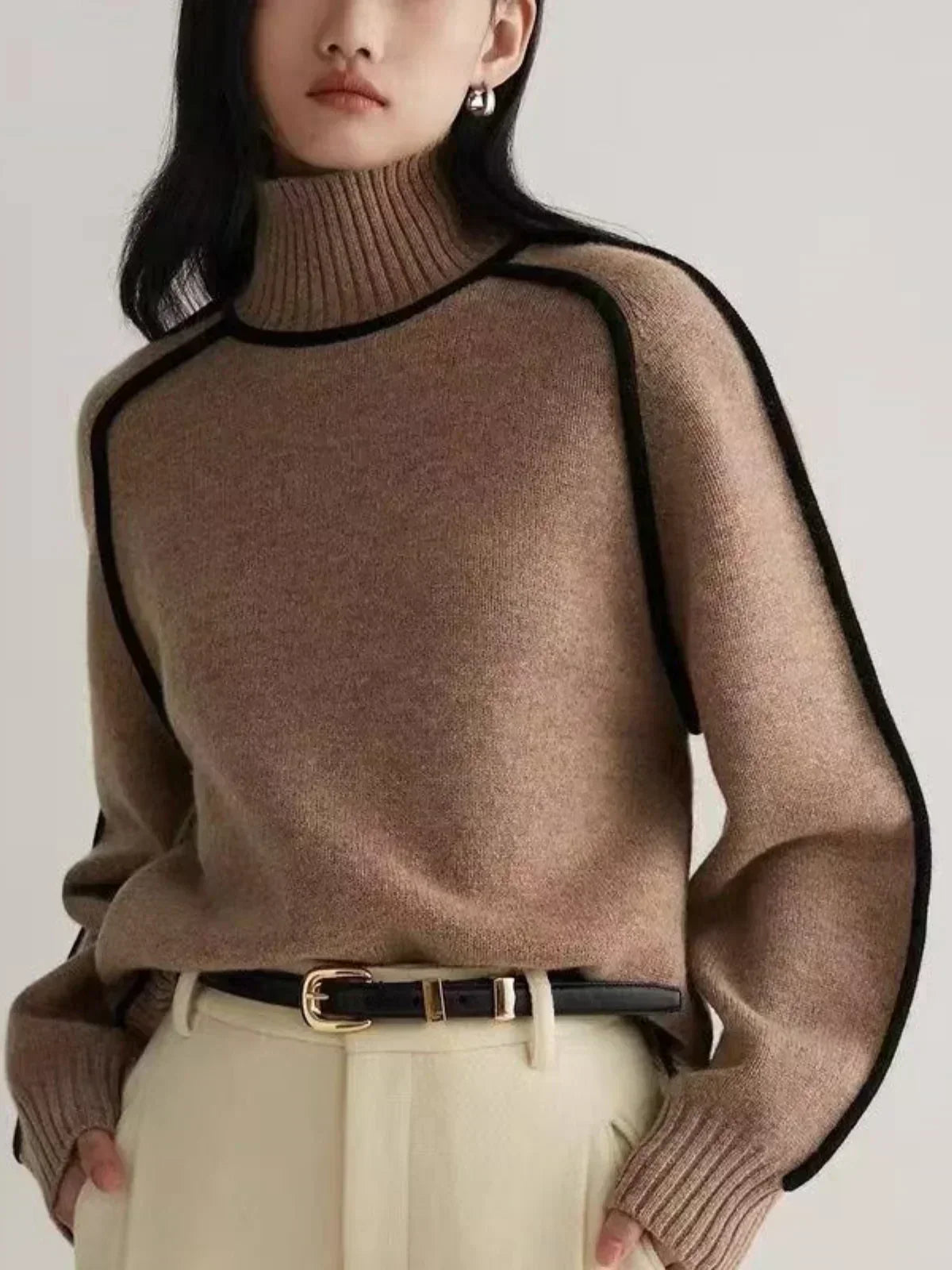 Brown oversized turtleneck sweater by Christine Brewer with luxe wool edge trim, perfect for autumn, featuring a tailored versatile design.