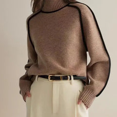 Brown oversized turtleneck sweater by Christine Brewer with luxe wool edge trim, perfect for autumn, featuring a tailored, versatile style.