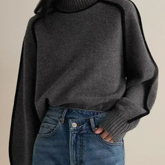 Black Clara turtleneck sweater for women by Christine Brewer featuring luxe wool edge trim, perfect for autumn wear.